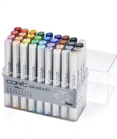 the copic sketch markers are lined up in a clear holder on a white background