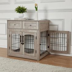 a wooden cabinet with two doors and one door open on the floor next to a white rug