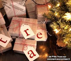 wrapped presents sitting on top of a table next to a christmas tree