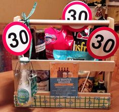 a wooden crate filled with lots of food and drinks