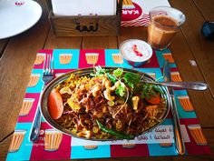 a plate of food on a colorful place mat