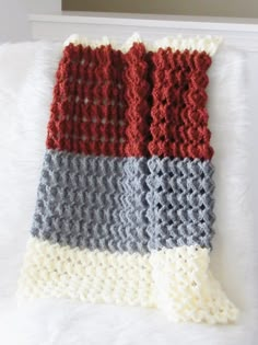 crocheted dishcloths in different colors on a white surface with a mirror behind them