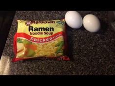 ingredients for ramen noodle soup laid out on a granite countertop next to an egg