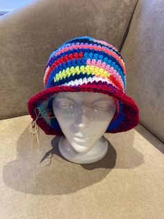 "hand made crocheted bucket/sun hat Size: 24\"-27\" Typical head circumference sizes: 21\" Xsmall 22\" Xs/Small 23\" Small/Medium 24\" Medium/Large 25\" Large/XL Material: 100% acrylic Wearable  Foldable for your purse  One of a kind hat Head Size in Inches Head Size in Centimeters American Hat Sizes   Head Size in Inches                          Head Size in Centimeters                            American Hat Sizes 19 3/8\"                                                 49.2 cm Blue Bucket Hat For The Beach, Crochet Cotton Yarn Sun Hat With Curved Brim, Crochet Cotton Sun Hat With Curved Brim, Adjustable Crochet Wide Brim Hat, Multicolor Bucket Hat For The Beach, Multicolor Bucket Hat For Beach, Cotton Yarn Crochet Hat With Curved Brim, Adjustable Multicolor Cloche Hat For Beach, Multicolor Short Brim Cloche Hat For Beach