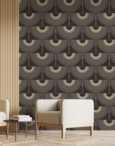 an art deco wallpaper with black and gold designs on the walls, along with two chairs