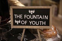 there is a sign that says the fountain of youth in front of some breads