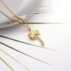 Diamond Palm Tree Leaf Tropical Beach Necklace, Dainty Gold California Summer Necklace, Gold Palm Tree Leaf Pendant,Tropical Ocean Jewelry Our gold diamond necklaces are perfect choice for a Christmas, Mother's Day, valentine's day, birthday, wedding, anniversary, graduation, engagement, bridesmaid, and best friends gift. It's a good way to show appreciation to your mom, girlfriend, wife, grandmother, grandchildren, daughter, sister, best friend, boss or a co-worker. Also, a special treat just f California Necklace, Gold Palm Tree, Tropical Necklace, Palm Tree Leaf, Palm Tree Necklace, Palm Tree Pendant, Palm Leaf Design, Tropical Jewelry, Tropical Ocean