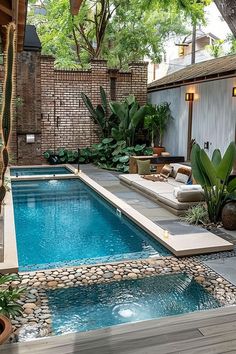 an outdoor pool surrounded by trees and plants