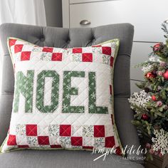 a christmas pillow with the word noel on it