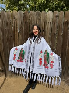 This beautiful Traditional Shawl is completely unique in both design and embroidery.  Beautiful traditional Virgin Mary design and has tassels at the end. (Colors may vary as they uniquely made although same design)  This Shawl can be used  like a wrap around blanket, blanket , table runner, gift,  it is warm, comfortable and stylish.  One Size Fits All SIZE  WIDTH 31 inches  LENGTH 87 inches Embroidered White Shawl For Traditional Ceremonies, White Shawl For Traditional Ceremonies, Traditional White Shawl For Festival, White Embroidered Shawl For Traditional Ceremonies, Bohemian Embroidered Shawl Traditional Wear, Traditional Embroidered One-size Shawl, White Bohemian Shawl With Floral Embroidery, Bohemian Embroidered White Shawl, Virgin Mary Design