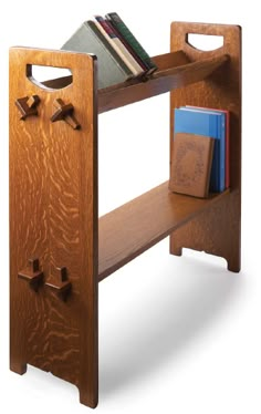 a wooden shelf with books on it and a book case in the bottom section,