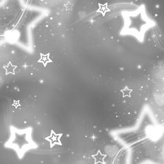 white stars are flying in the air on a black and white background with blurry lights