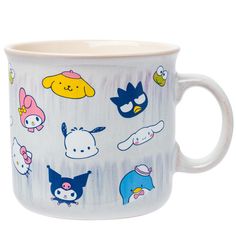 a white coffee cup with cartoon characters on it's front and side rims