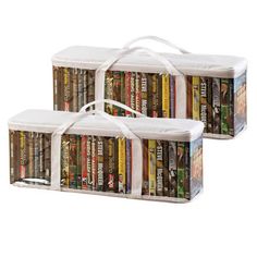 three packages of books with white ribbons on them