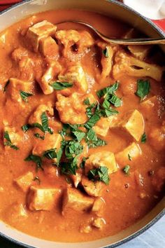 a pan filled with curry and tofu