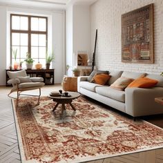 a living room filled with furniture and a rug on the floor in front of a window