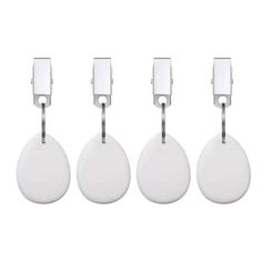 four white round tags hanging from hooks on a white background with clippings for each one