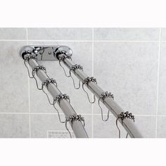 an overhead shower head and hand rail in a bathroom