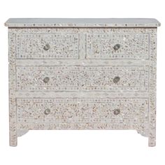 an ornate white dresser with drawers on one side and two drawers on the other end