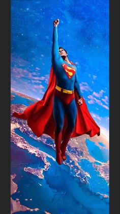 superman flying over the earth with his arms in the air