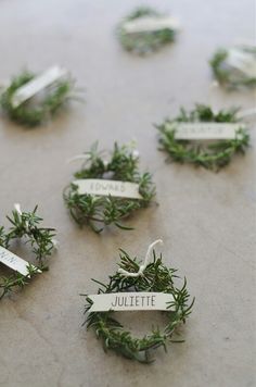 several small wreaths with name tags attached to them