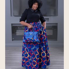 This  African  prints  maxi  skirt and handbag set is a  statement  piece  for  any  wardrobe  and  is  crafted  with  an  elastic  waistband  that  will  fit  all  waist  sizes.  It  features  a  bold,  vibrant  African-inspired  print  with  intricate  details.  The  skirt  has  a comfortable  high  waistband  and  deep  pockets,  allowing  you  to  store  your essentials  while  looking  stylish.  The  full-length  silhouette  is  perfect  for  any occasion,  from  casual  days  to  formal  events. Skirt  length  is  74cm  and  comes  with  a  waist  band  tie  of  274 cm  long  that  can  be  tie  round  the  waist  to  make  a  bow  tie  and  can also  be  use  for  a  headband  and  perfect  for  any  season. Our matching handbags comes in set with the Maxi skirt and are designed to Skirt African Print, Make A Bow Tie, African Maxi Skirt, African Skirt, African Skirts, Ankara Skirt, African Prints, Long Maxi Skirts, Gathered Skirt