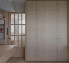 an empty room with wooden cabinets and shelves