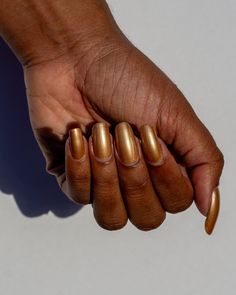 Turn your nails into a chart topping sensation with Beautifully Bold, Gold! This striking burnt gold metallic is a sight to behold, turning heads with nails made of gold. Fun Fact - Inspired by the gold records in the Glitter and Gold song. Pro Tip - The more layers you add the richer and more intense this shade gets. Gold Crackle Nails, Gold Finger Nail Polish, Golden Nail Polish, Golden Rose Nail Polish, I Hate Mondays, With Nails, Glitter Flake, Donut Shop, Indie Nail Polish