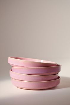 three pink bowls stacked on top of each other