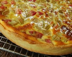 a pizza sitting on top of a metal rack