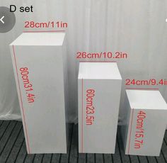 three white boxes are shown with measurements for each one and the other is labeled in red