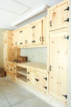 an unfinished kitchen with wooden cabinets and drawers