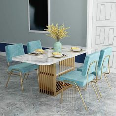 a dining room table with blue chairs and a vase filled with yellow flowers on it