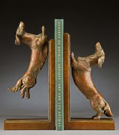 a bookend with two hands reaching for each other