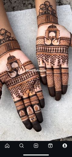 two hands with henna designs on them