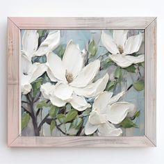 a painting with white flowers in a wooden frame