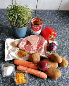 the ingredients are laid out on the counter to be used for this meal, including carrots, potatoes, and meat