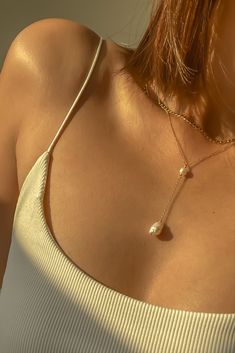 Warm glow on our Elle lariat necklace featuring gold filled chain with freshwater pearls — can wear it in the shower? Check! Baroque Pearl Lariat Necklace With Pendant, Chic Adjustable Pearl Necklace, Pearl Lariat Drop Necklace With Pearl Drop, Baroque Pearl Lariat Necklace With Pearl Charm, Lariat Baroque Pearl Drop Jewelry, Baroque Pearl Drop Lariat Jewelry, Baroque Pearl Lariat With Pearl Drop, Double Strand Pearl Drop Necklace, Pearl White Drop Necklace For Gift