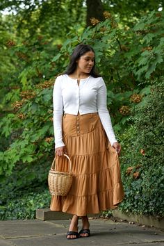 Romantic cottage core inspired vintage maxi tired skirt, the Pumpkin skirt was inspired by past vintage style with a back elastic band along with a five button closure front and belt loops. The Pumpkin skirt features a half slip. 100% Polyester / Half Lined Hand Wash Cold / Line Dry Hidden Side Pockets Fit Notes & Measurements Rosa is 5’6 and wearing a size small XS: 27" length / 25"-27" waist / max 34" hips S: 27.5" length / 27"-29" waist / max 36" hips M: 28" length / 29"-31" waist / max 38" h Tired Skirt, Pumpkin Skirt, Cottage Core Style, Retail Boutique, Bodice Top, Romantic Cottage, Half Slip, Clothing Retail, Curated Vintage