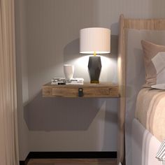 a nightstand with a lamp on it next to a bed