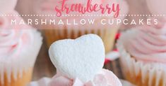 cupcakes with marshmallow hearts on them and the words strawberry marshmallow cupcakes