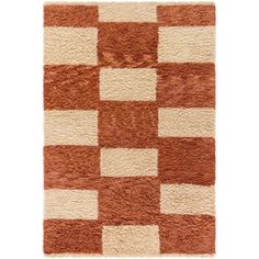 a brown and white rug with squares on it