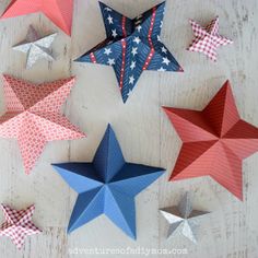 red, white and blue paper stars arranged on a table