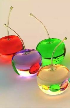 three apple shaped lights sitting next to each other