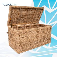 an empty wicker chest with lid open on a blue and white geometric pattern background