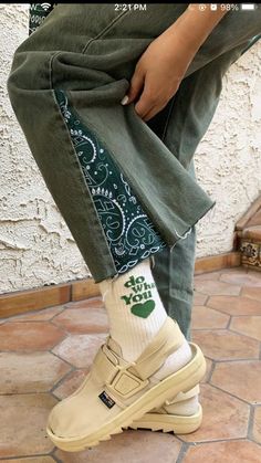 someone wearing green pants and white socks