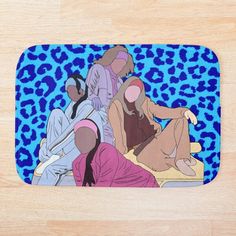 two women sitting on a leopard print bath mat with blue background and wood flooring