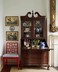 an old china cabinet in the corner of a room