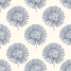 a blue and white wallpaper with large fan like shapes