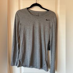 Nike Dri-Fit, Gray, Long Sleeved T-Shirt. Size Small. Never Been Worn. Nike Crew Neck T-shirt For Fall, Nike Basic Tops For Fall, Nike Basic Relaxed Fit Tops, Nike Gray Tops For Fall, Nike Basic Tops With Relaxed Fit, Basic Nike Tops For Fall, Heather Grey Crew Neck Workout Top, Nike Workout Tops For Fall, Nike Gray Stretch Top